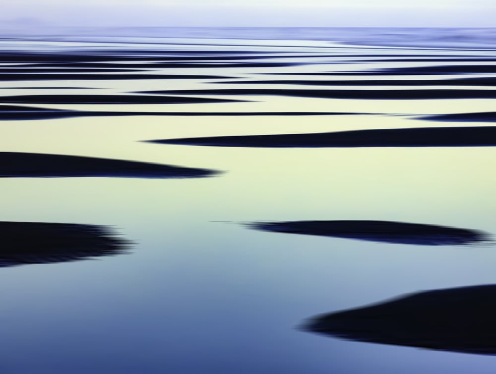 Abstract of sandbars and large tide pools on the Pacific coast of Olympic Peninsula in Washington, USA, for themes of nature, repetition, serenity, the environment (one of a series)-1