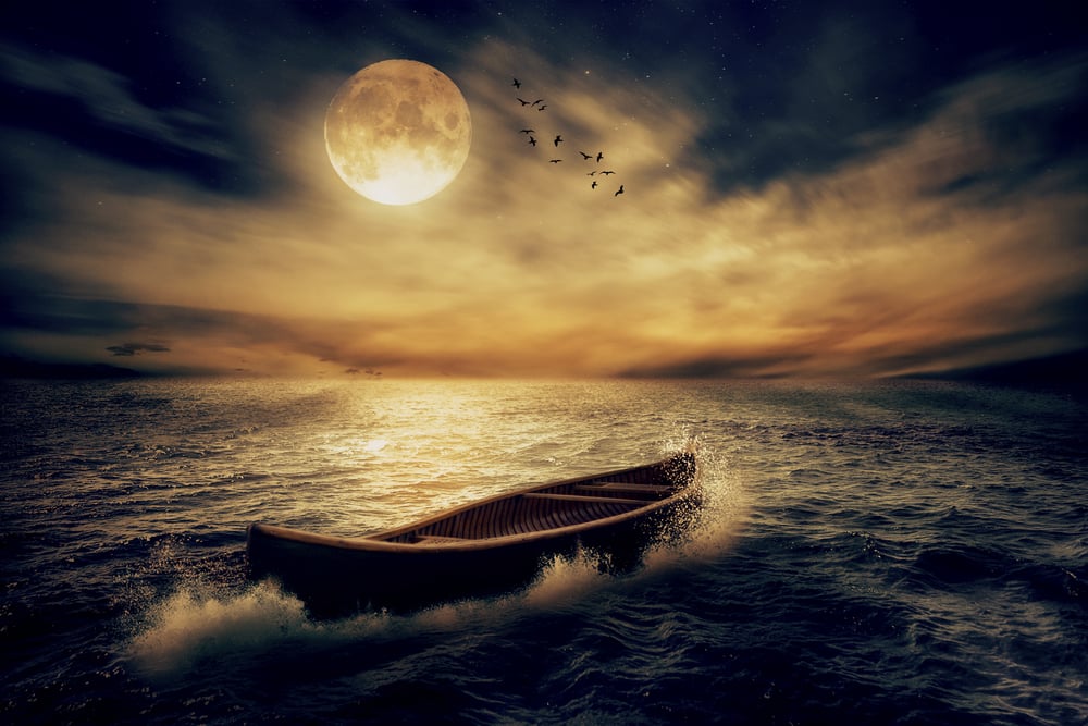 Boat drifting away in middle ocean after storm without course moonlight sky night skyline clouds background. Nature landscape screen saver. Life hope concept. Elements of this image furnished by NASA-3