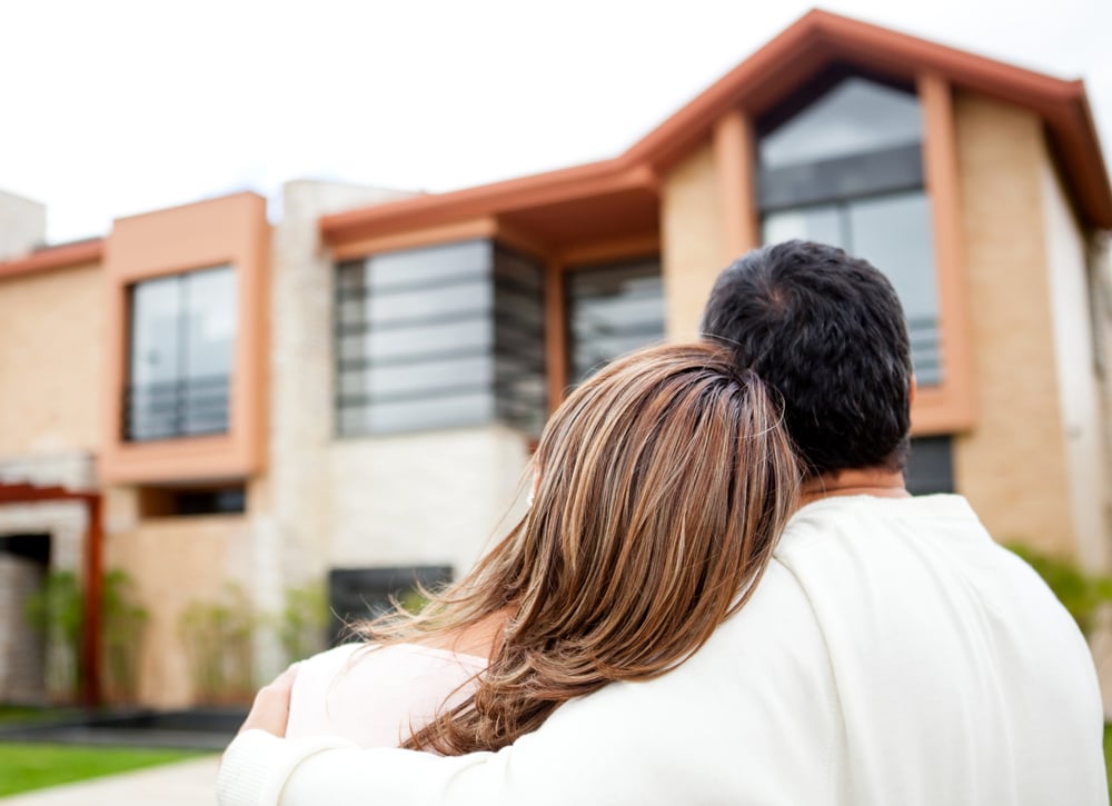 Loving couple looking at their dream house