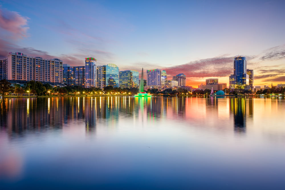 Orlando, Florida, USA downtown city skyline on Eola Lake.