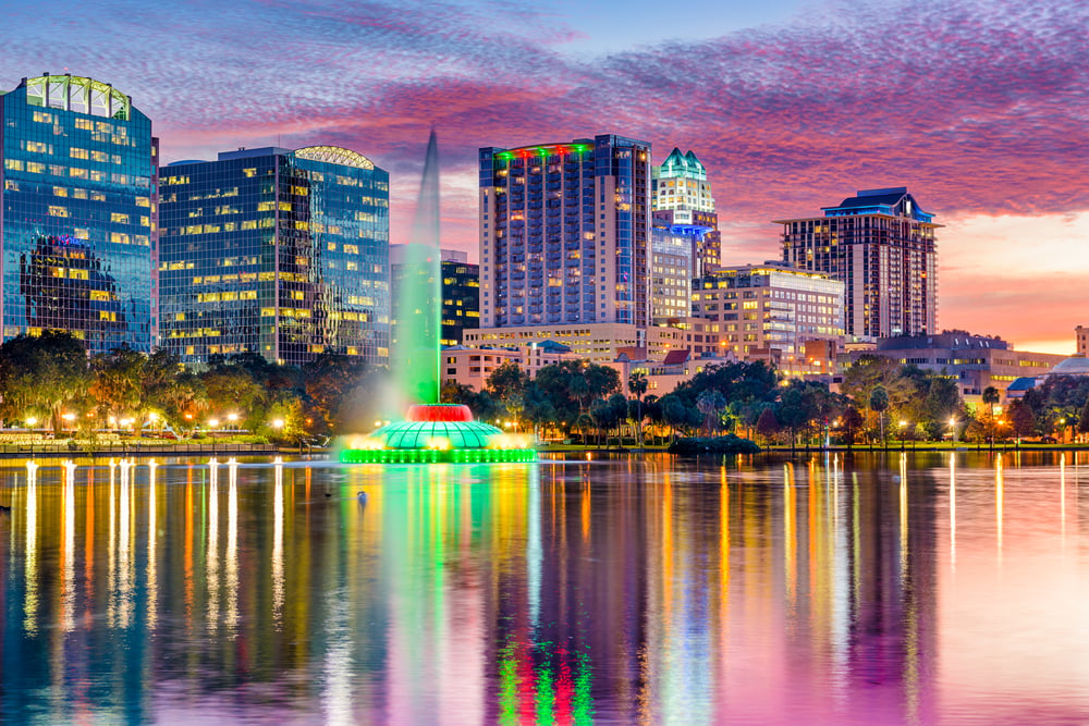 Orlando, Florida, USA skyline at dusk on Eola Lake.