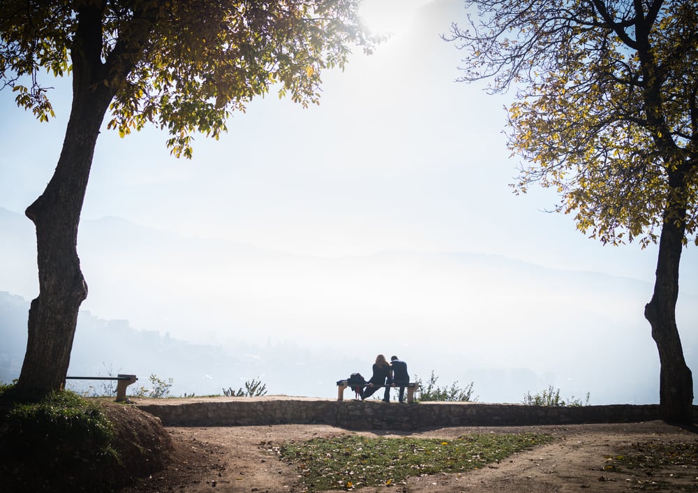 People in beautiful park with city view