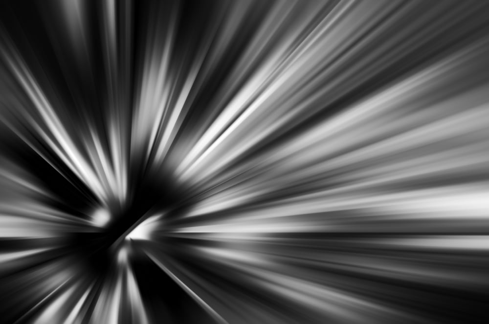 Starburst with radial blur in black and white, for motifs of origin, expansion, or contraction in decoration and backgrounds