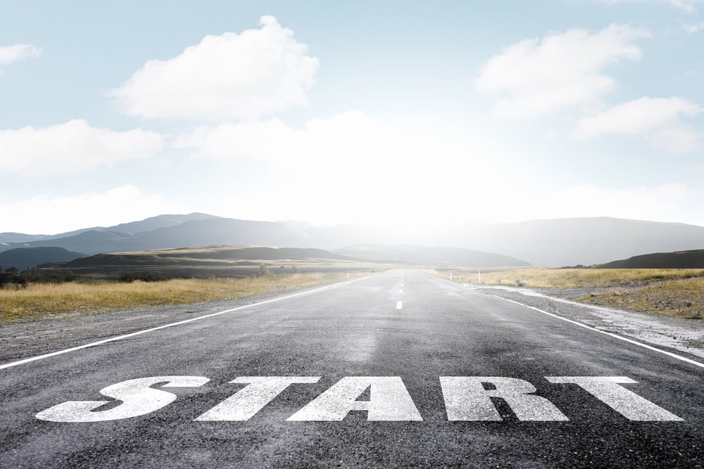 Start word as motivation writen on asphalt road