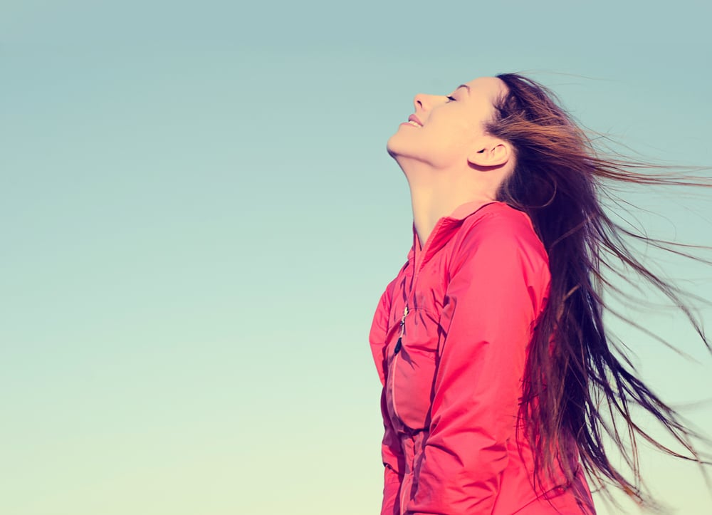 Woman smiling looking up to blue sky taking deep breath celebrating freedom. Positive human emotion face expression feeling life perception success peace mind concept. Free Happy girl enjoying nature-1