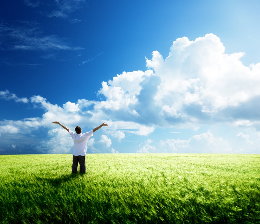 happy young man rest on wheat field-1