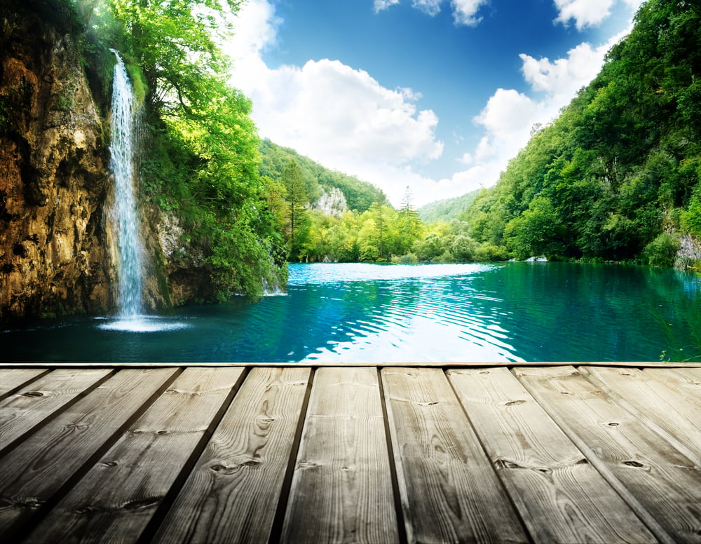 waterfall in deep forest of croatia and wood pier