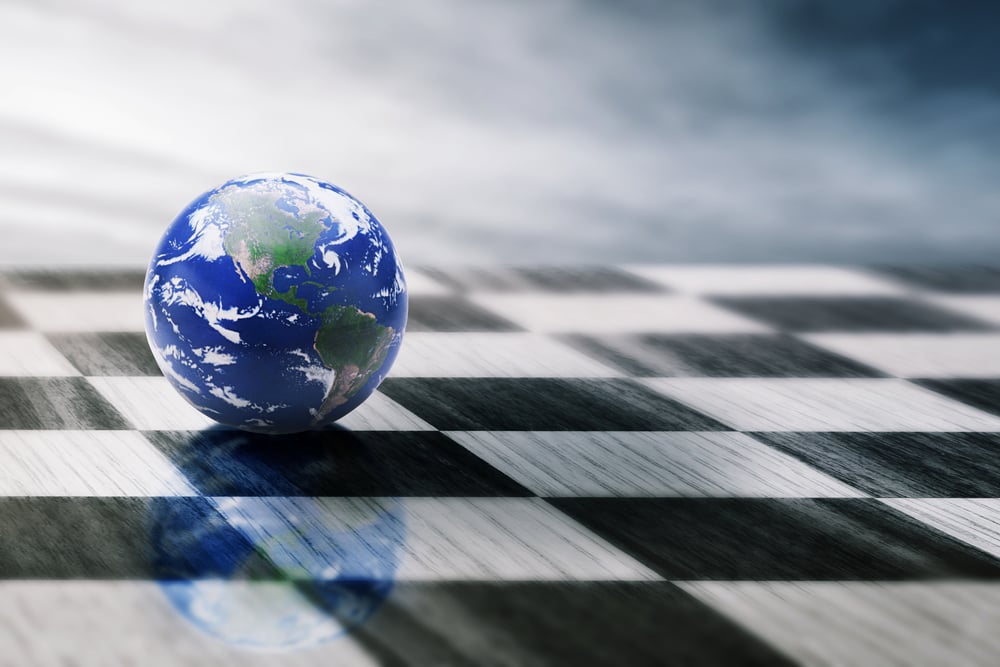 world on a chessboard isolated on blue sky background. Elements of this image furnished by NASA-2