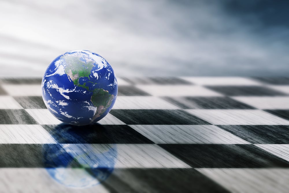 world on a chessboard isolated on blue sky background. Elements of this image furnished by NASA-3